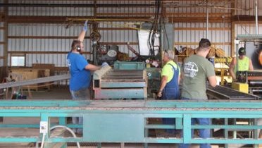 Crew Working On Sawmill